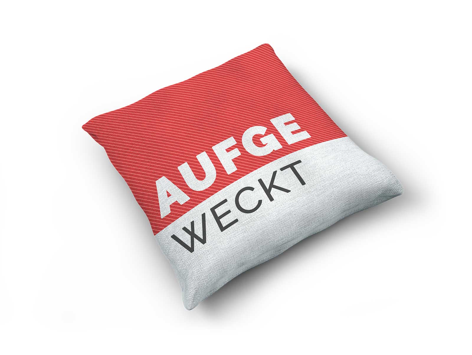 Bild von einem Kissen mit Aufdruck aufgeweckt